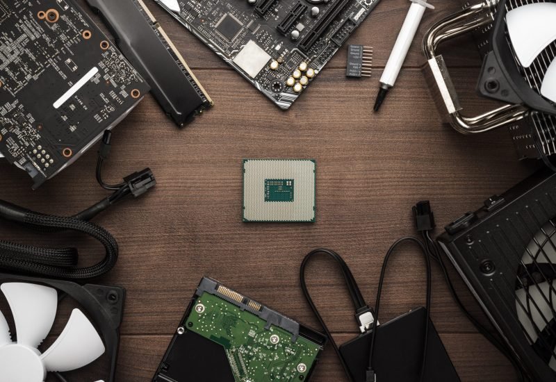 central processing unit and other computer parts on the wooden table. building personal gaming and video production pc concept