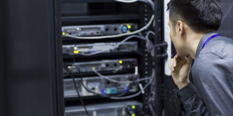 Technician doing maintenance in computer room